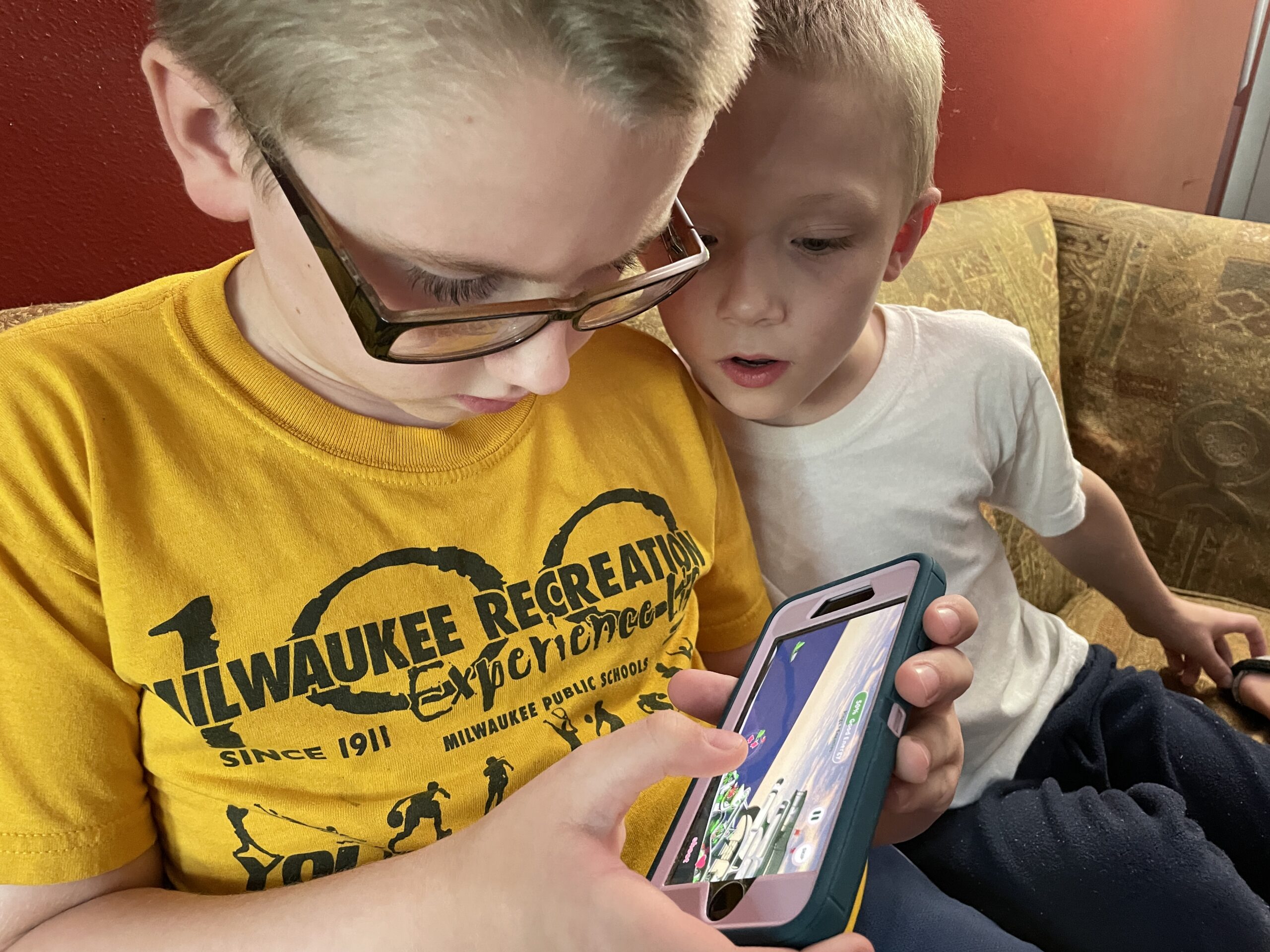 Two kids playing LuvBug Learning, a social-emotional learning app