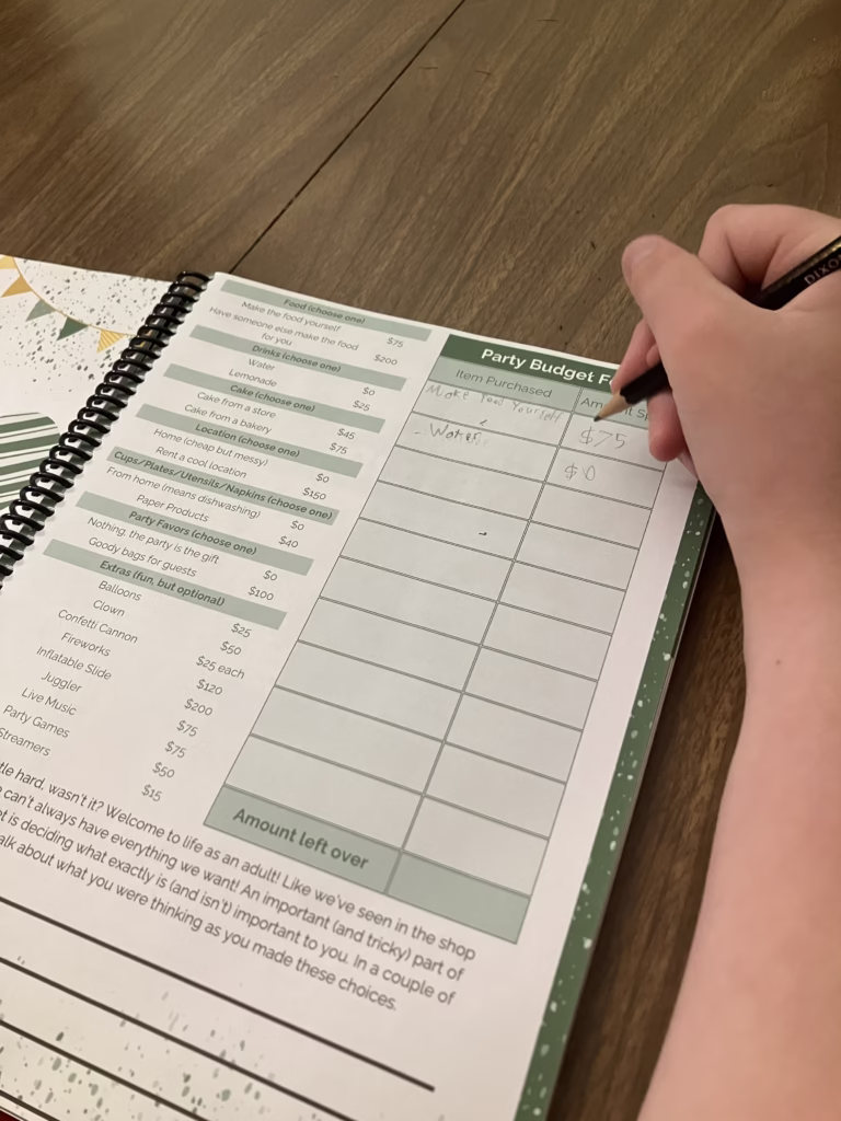 Personal finance is an important life skill to teach in your homeschool. Beyond Personal Finance offers kids real practice in this skill. A teen works on his party budget in Before Personal Finance. 