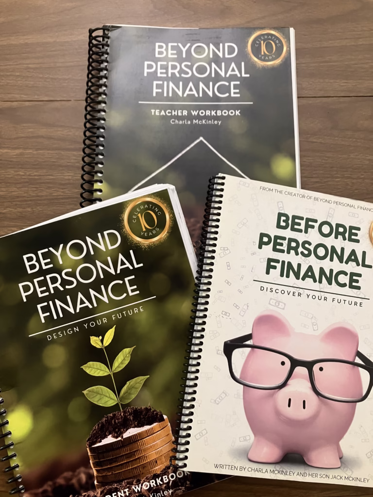 Personal finance is an important life skill to teach your homeschoolers. Beyond Personal Finance offers kids real practice in this skill. Beyond Personal Finance Student workbook and teacher workbook are pictured, as well as the Before Personal Finance workbook. 