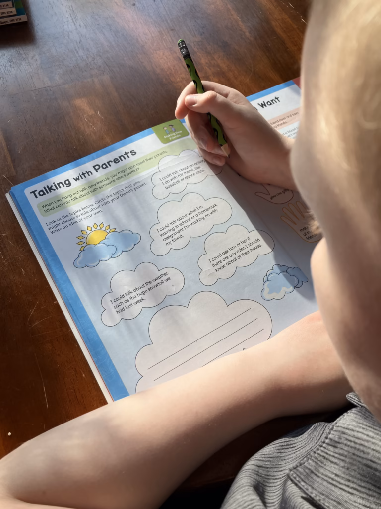 A thoughtful well-designed workbook can be a great addition to your home school. Here's why Evan-Moor is a great fit for that.  A child reads a page about how to talk to parents of your friends from Evan-Moor Social Skills grades 5-6.